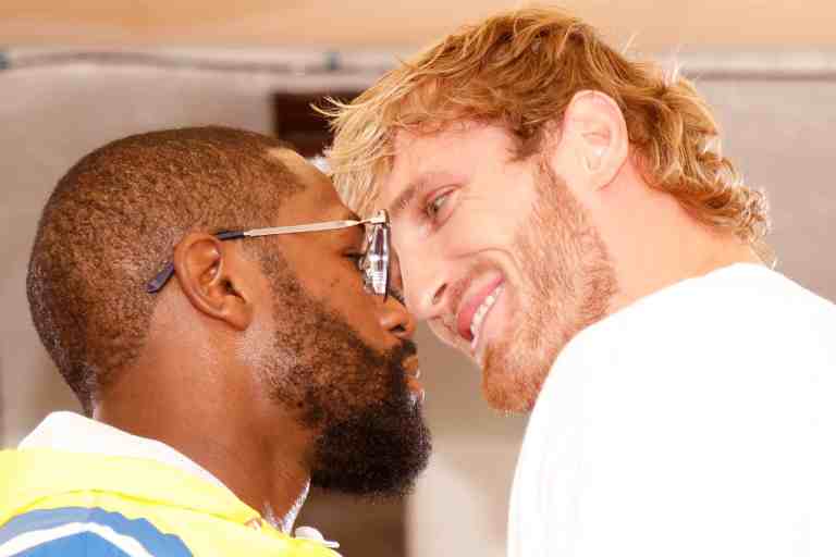 YouTuber Logan Paul jokes Floyd Mayweather tried to kiss him during an intense pre-fight staredown ahead of their big matchup in Miami this weekend.