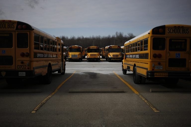 An investigation has been launched after a video shows a parent screaming and cursing at students after his child was hit.