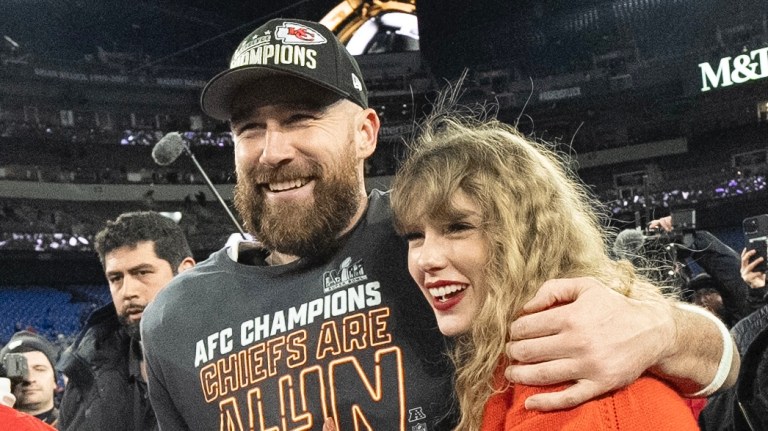 FILE - Kansas City Chiefs tight end Travis Kelce and Taylor Swift walk together after an AFC Championship NFL football game between the Chiefs and the Baltimore Ravens, Jan. 28, 2024, in Baltimore.. Taylor Swift, who is holding concerts in Japan, will make it in time for the Super Bowl to see her partner and football superstar Travis Kelce play.